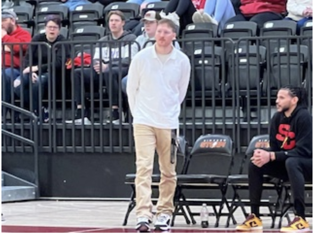 New head coach Ike Papes coaching the team to his first career victory against Luther.